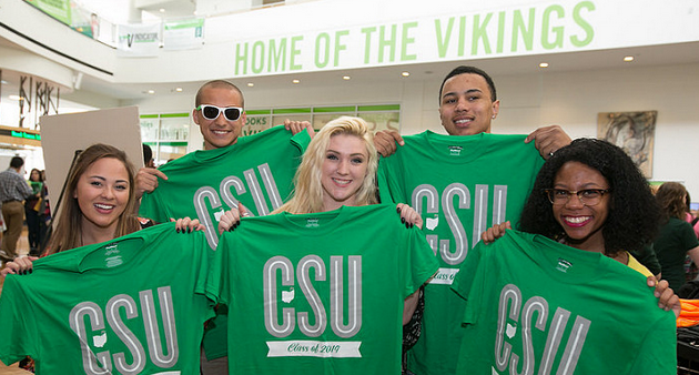 International students posing with CSU t-shirts